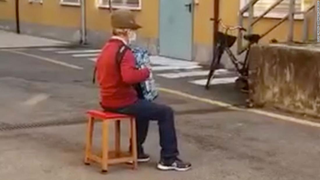 Italian man, 81, serenades his sick wife from outside hospital