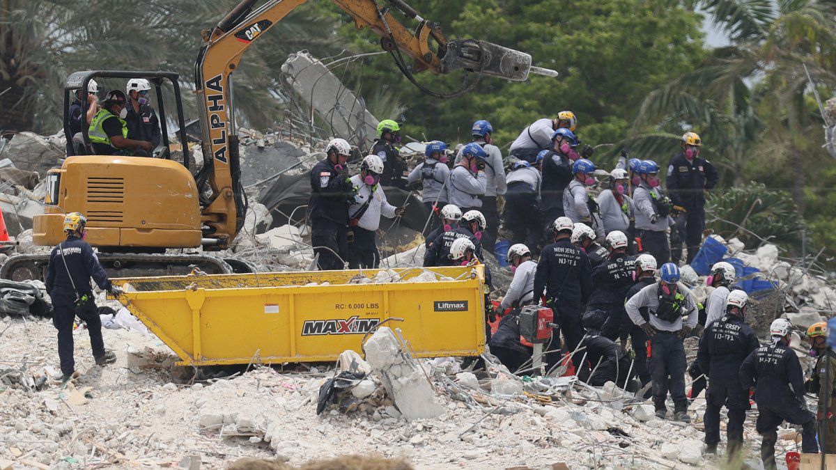 Florida on alert for Elsa, complicating search for landslide victims