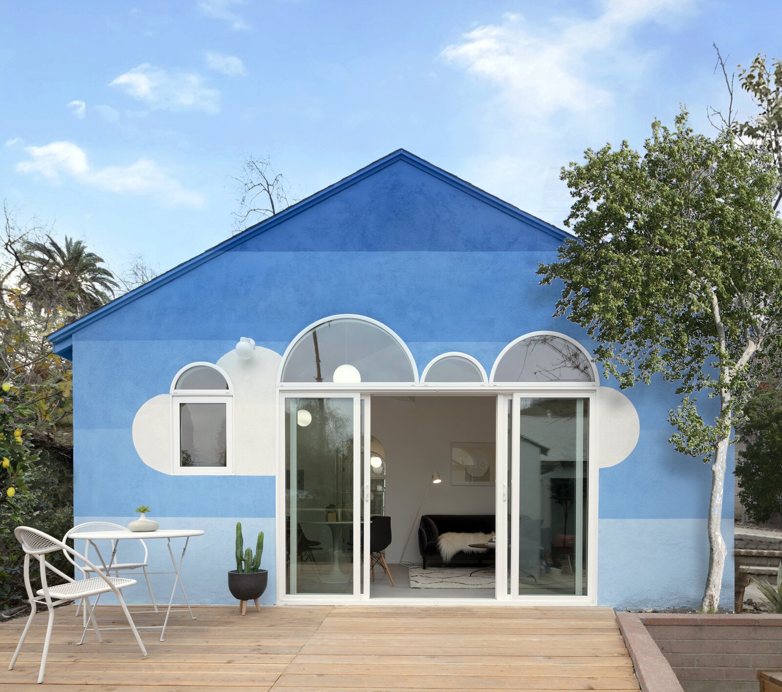 A Blue ADU With Cloud-Like Doors Represents the Los Angeles Sky