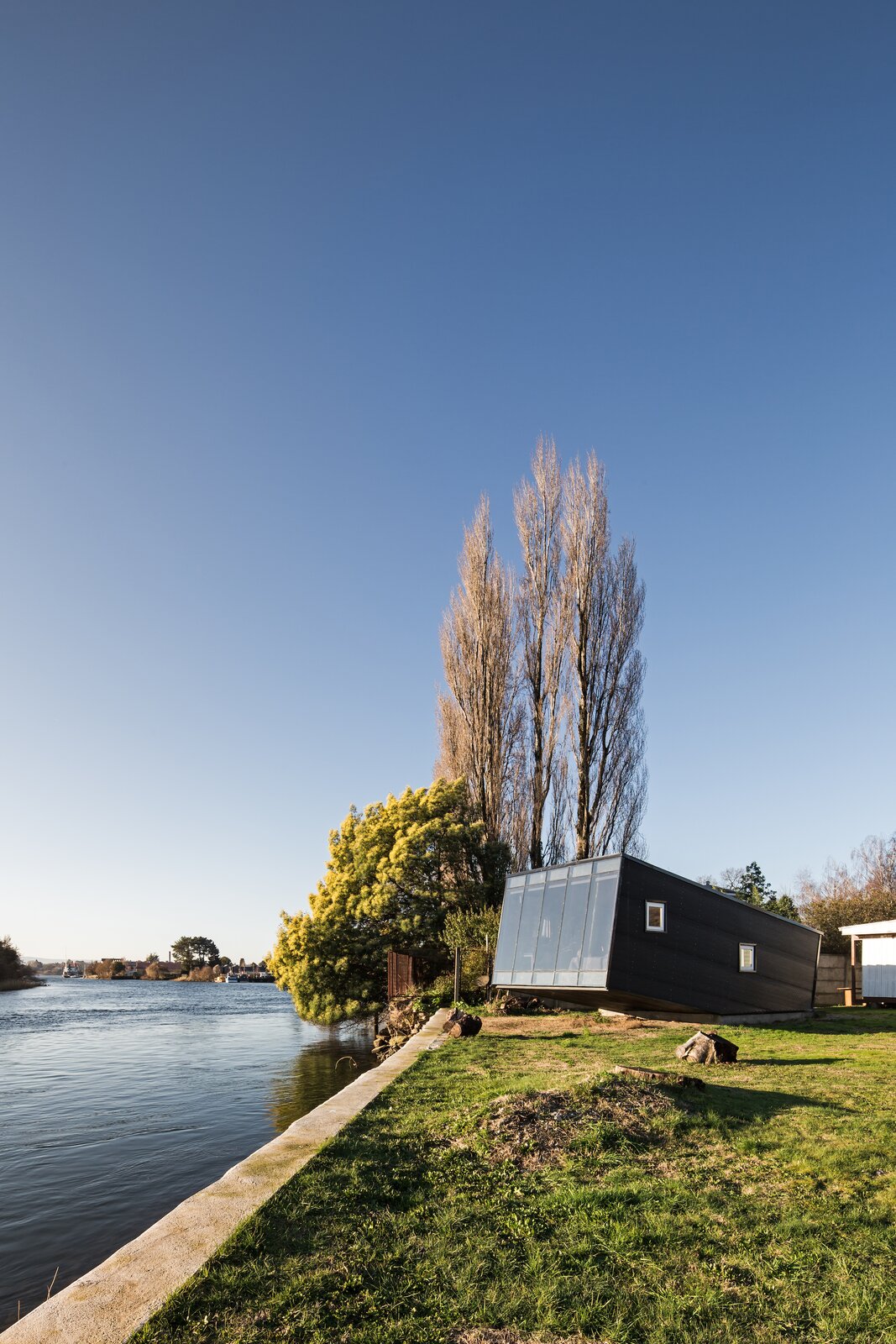 A Tiny, Prefab Cabin Soaks Up Riverside Views in Chile
